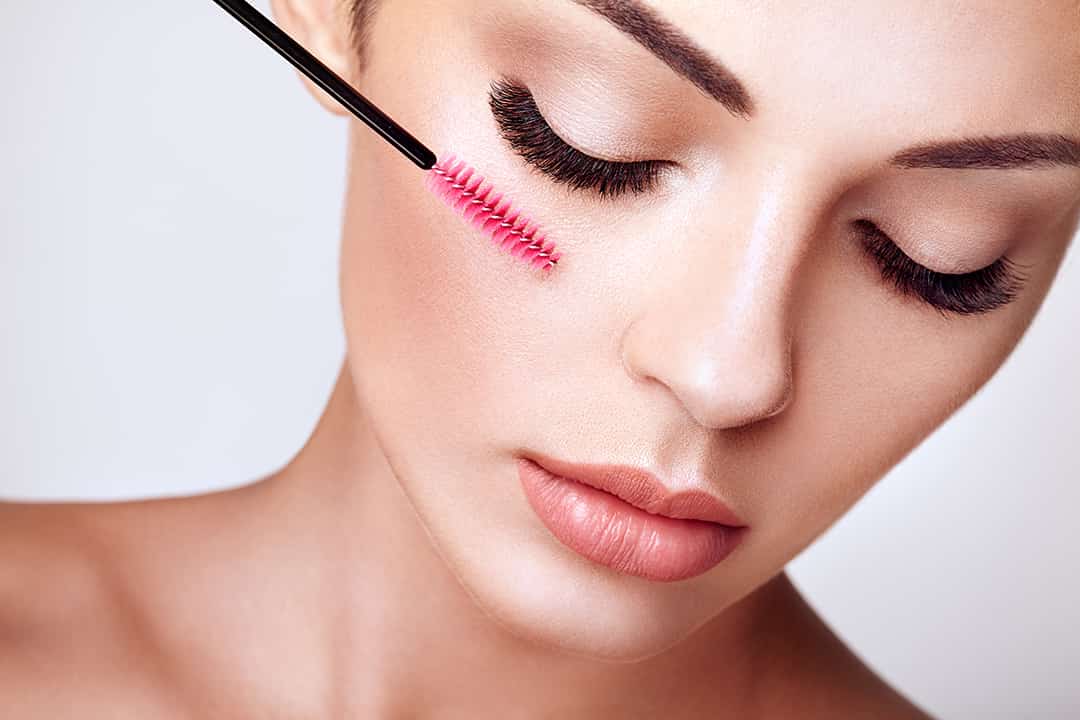 Beautiful woman with long false eyelashes